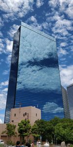 Low angle view of modern buildings against sky