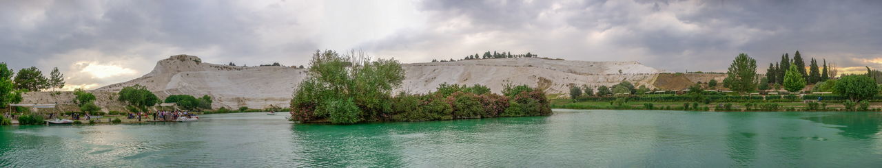 Panoramic view of lake against cloudy sky