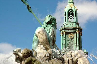 Low angle view of statue against sky