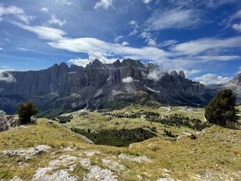 Scenic view of landscape and mountains against sky