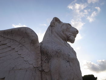 Low angle view of statue against sky