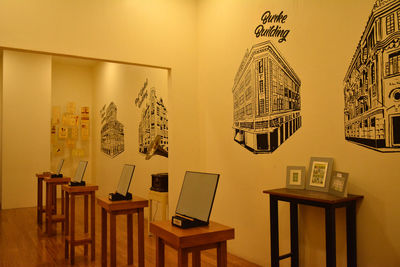 Empty chairs and tables against wall at home