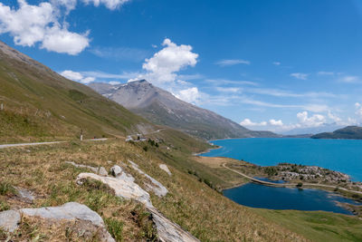 Scenic view of sea and mountains against sky