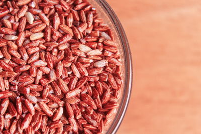 High angle view of red berries on table