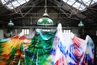 Multi colored umbrellas hanging on clothesline
