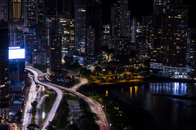 High angle view of illuminated buildings in city at night