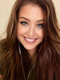 Close-up portrait of a smiling young woman