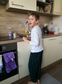 Boy standing at home