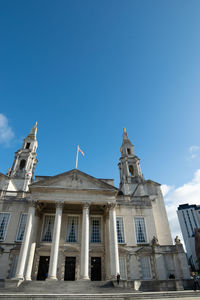 Low angle view of building against clear blue sky