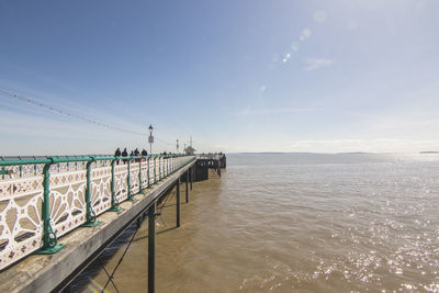 Pier over sea against sky