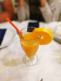 Close-up of orange juice on table