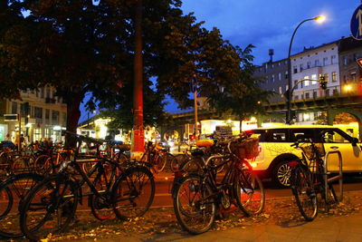 Cars parked in parking lot at night