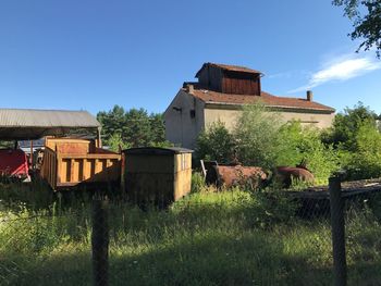 Abandoned built structure on field against sky