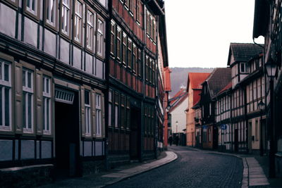 Street amidst buildings against sky
