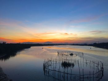 Scenic view of landscape against sky during sunset