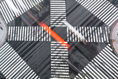 High angle view of crossing sign on road