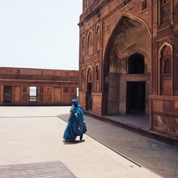 Man sitting in front of building