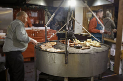 People working at market stall