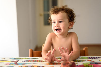 Cute smiling girl sitting at home