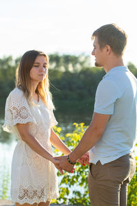Young couple standing outdoors