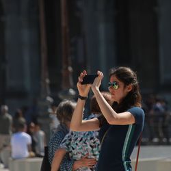 Side view of woman looking at camera