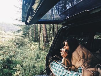 Close-up of woman sitting in car