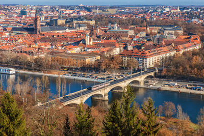 High angle view of bridge over river and buildings in city