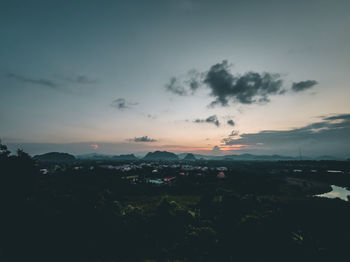 Scenic view of silhouette landscape against sky at sunset