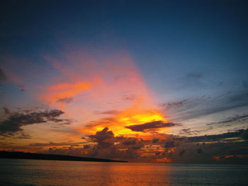 Scenic view of sea against romantic sky at sunset