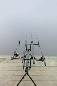 High angle view of fishing rods by lake