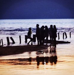 Woman standing on beach
