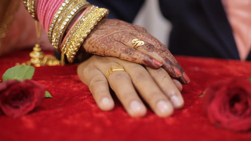 Midsection of woman with red hands