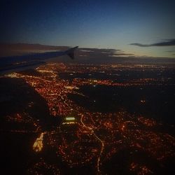 Aerial view of illuminated city at night