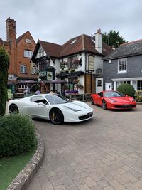 Cars on street by buildings in city