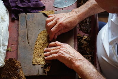 High angle view of man preparing food on table