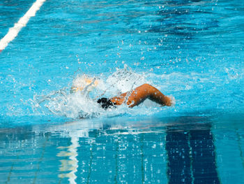 Man swimming in pool