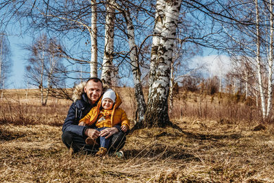 Portrait of a smiling young dad with son