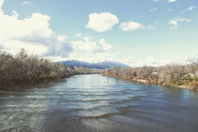 Scenic view of lake against cloudy sky