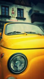 Close-up of yellow car