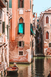 Canal amidst buildings in city