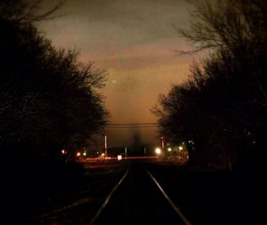 View of railroad tracks at night