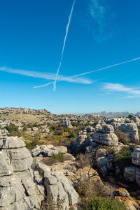 Scenic view of landscape against blue sky