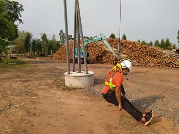 Architecture hanging on pulley at construction site