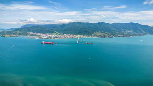 Boats in sea against sky