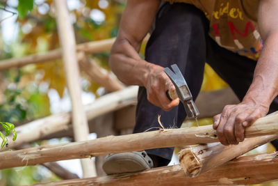 Midsection of man preparing food