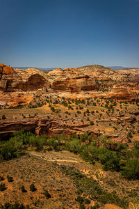 Scenic view of arid landscape against clear sky