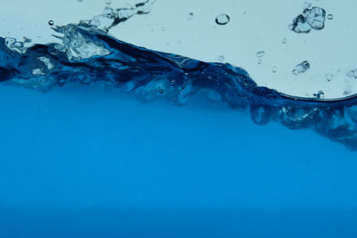 Close-up of water drops on blue sea