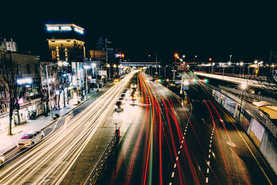 High angle view of light trails on road at night