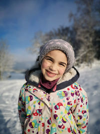 Portrait of a smiling woman in snow