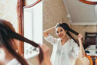 Portrait of smiling young woman at home